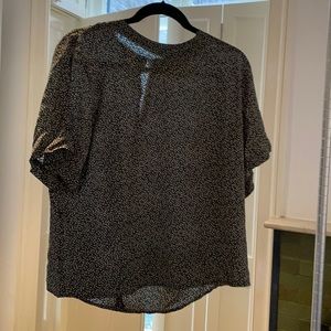 Silk black and white spotted Argenti top in size Medium.